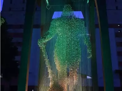 Green digital illustration of Hanuman as a technical superhero